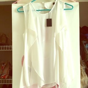 Blouse open in back.